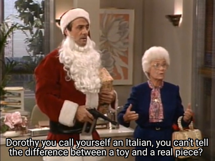 Sophia next to a guy dressed as Santa with a gun, saying Dorothy you call yourself an Italian, you can't tell the difference between a toy and a real piece?