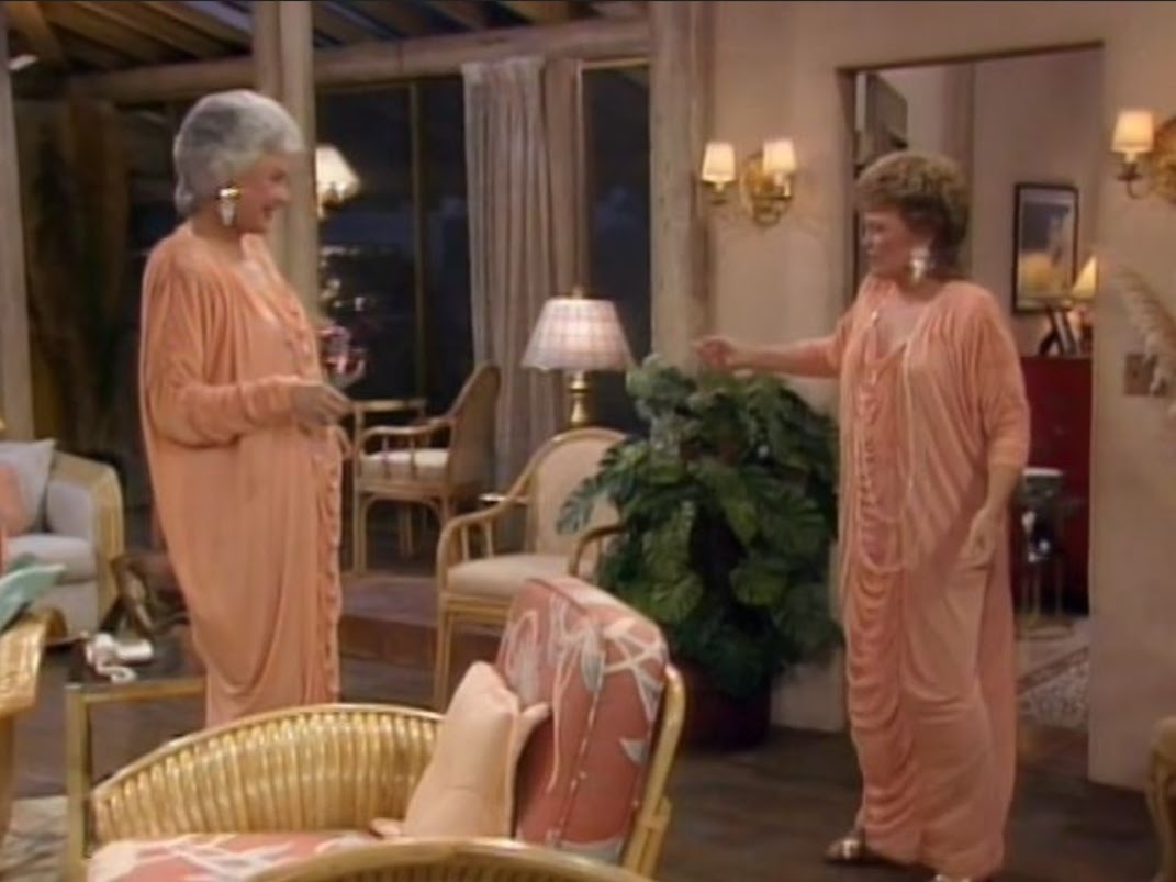 Dorothy and Blanche wearing the same rouched peach dress