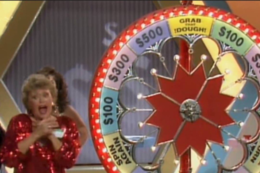 Blanche with the wheel on the Grab that Dough gameshow