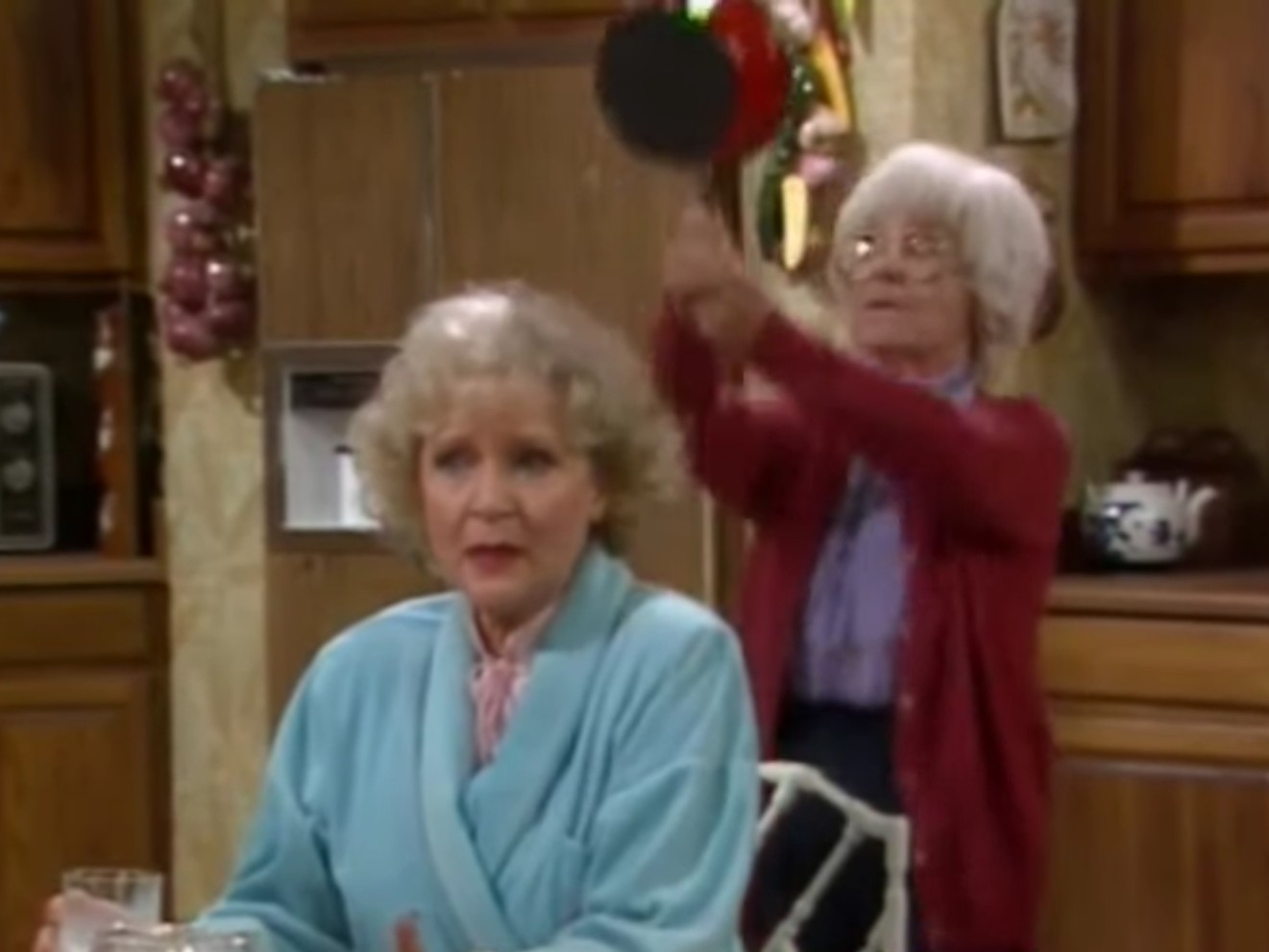 Sophia about to hit Rose on the head with a pan