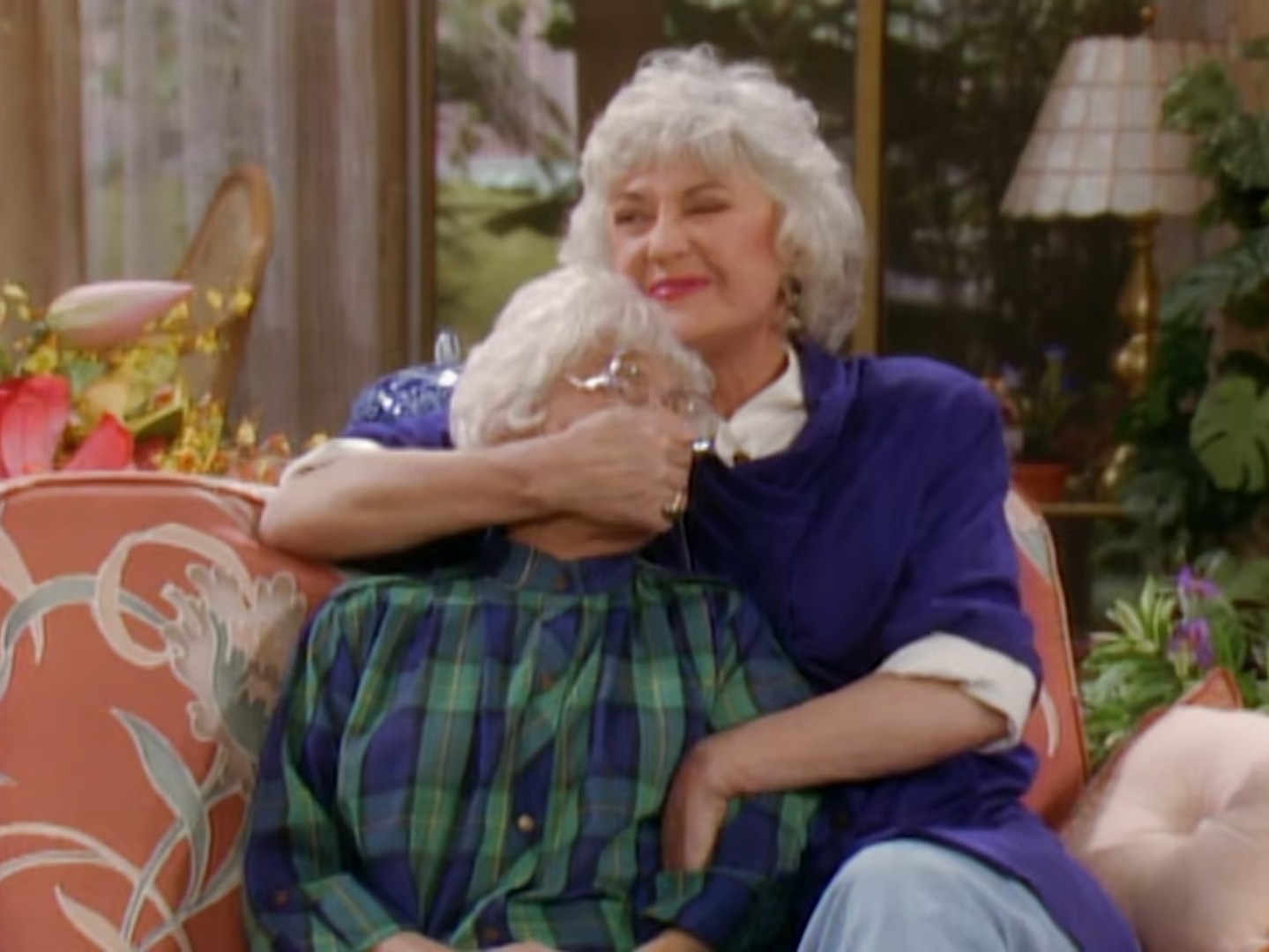 Dorothy with her hand over Sophia's mouth