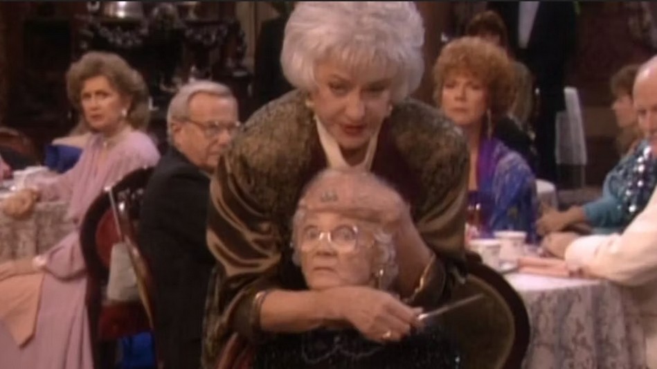 Dorothy holding a knife to Sophia's throat at a dinner event