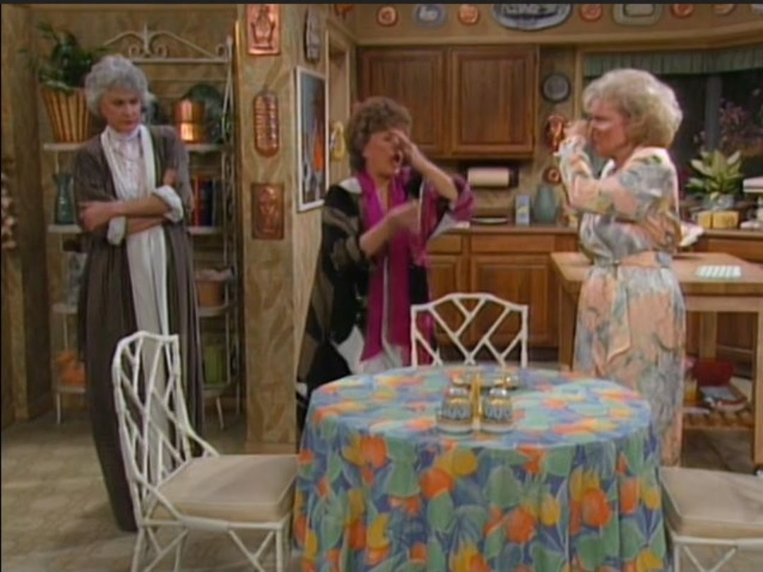 The girls eating Rose's food while holding their noses