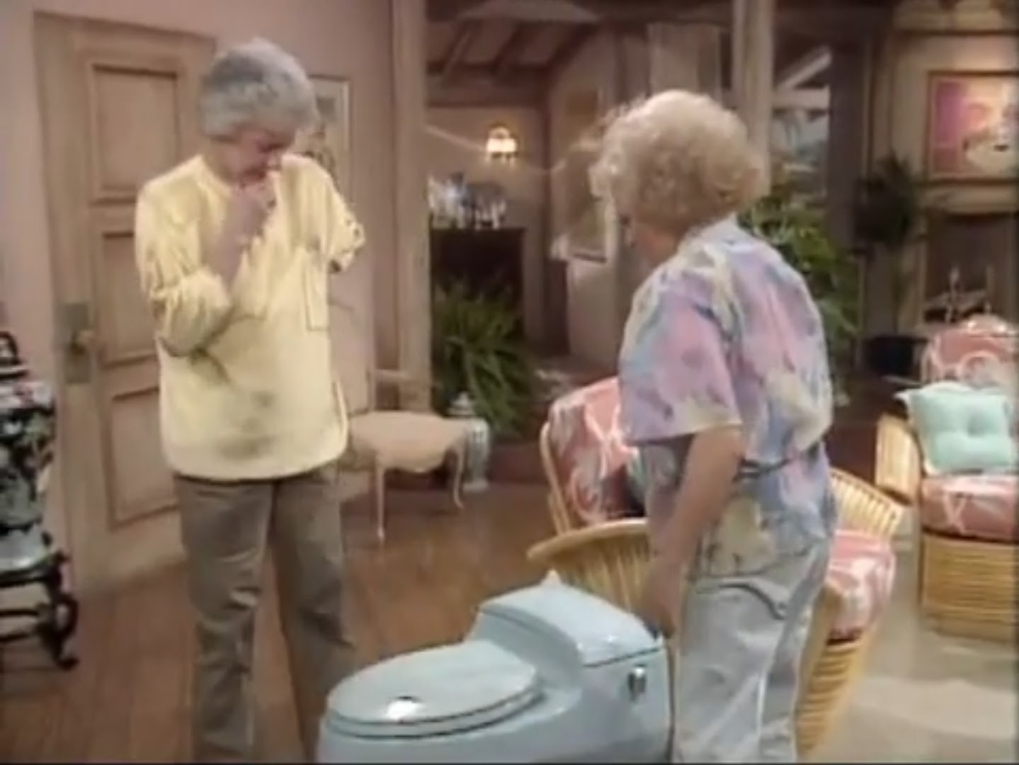 Dorothy and Rose with a new toulet seat in the living room